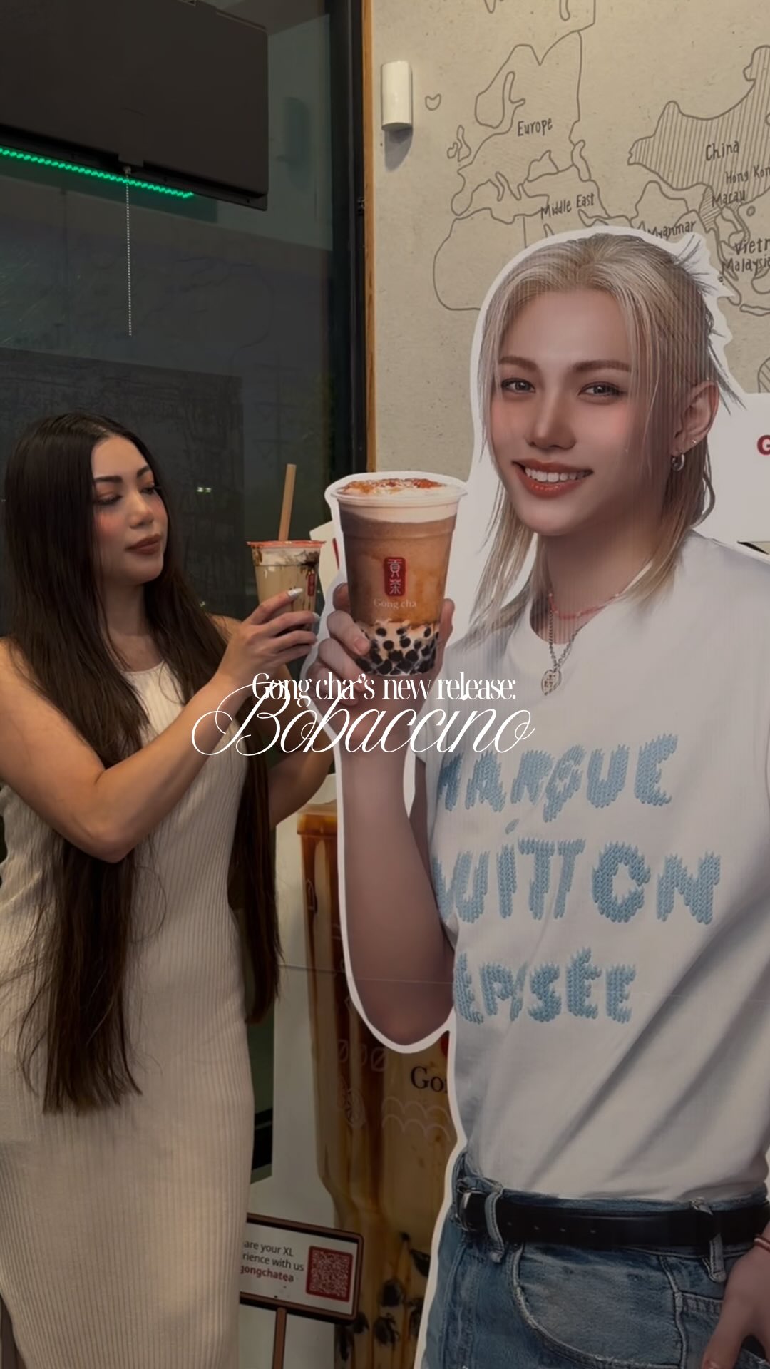 A Gong cha Bobaccino held up in a cafe, captioned "Gong cha's new release: Bobaccino"